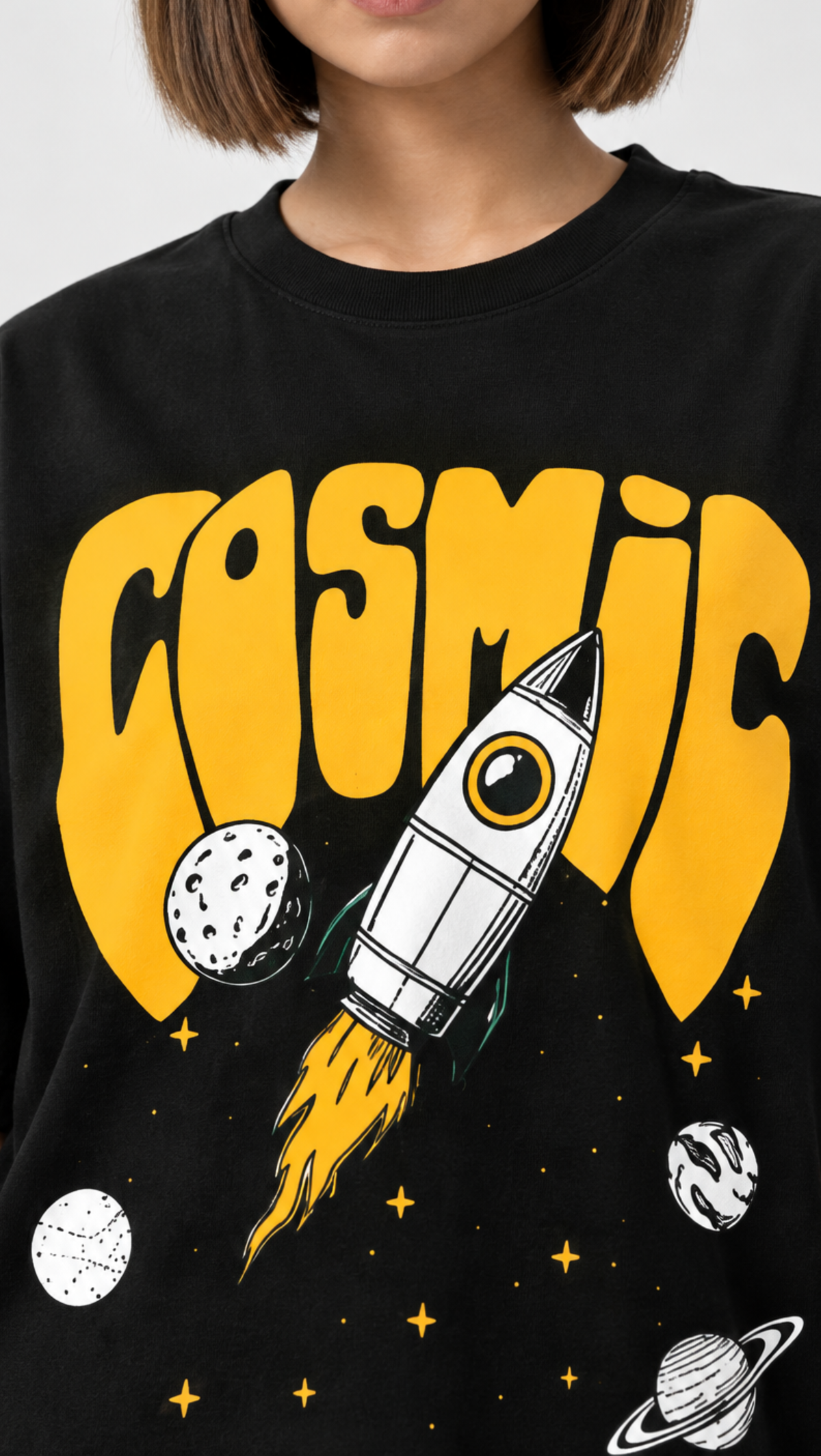 Cosmic print texture shown close up on the Dripzy black oversized tee