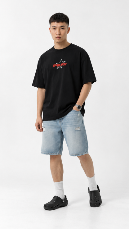 Pray lettering print shown close up on the Dripzy black oversized tee