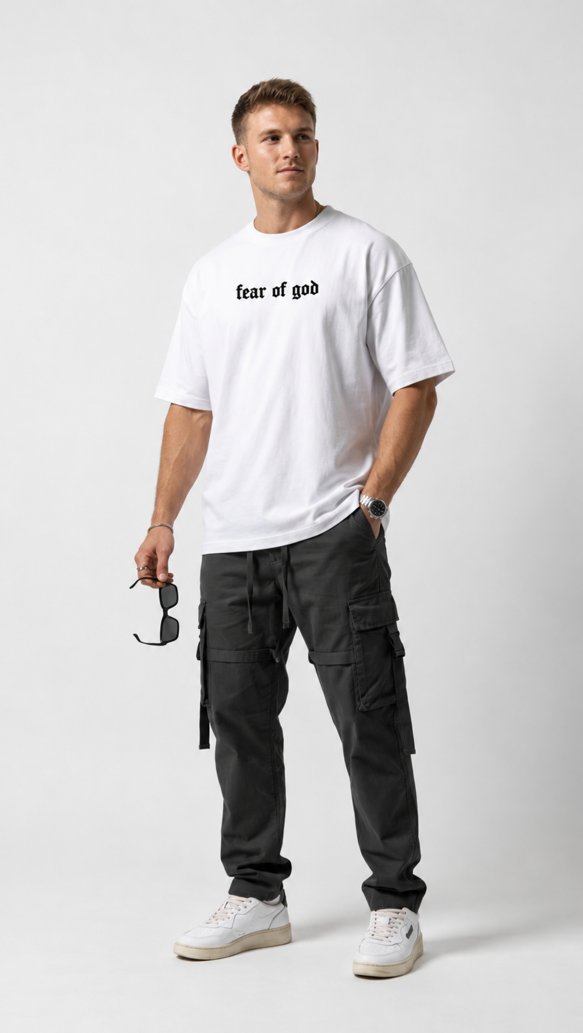 Minimal chest branding detail on the Dripzy white oversized essentials tee