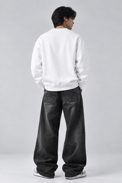 Dropped shoulder seam and ribbed hem on the Dripzy white oversized plain sweatshirt