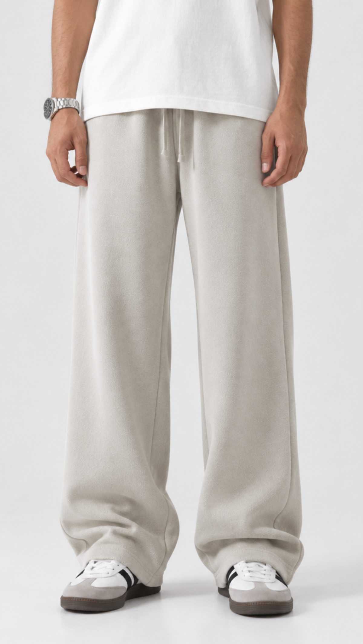 Elasticated drawstring waist detail on the Dripzy off-white relaxed trousers