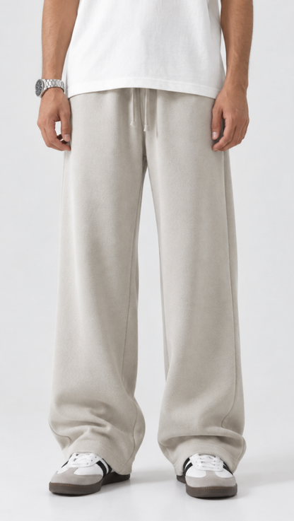 Elasticated drawstring waist detail on the Dripzy off-white relaxed trousers